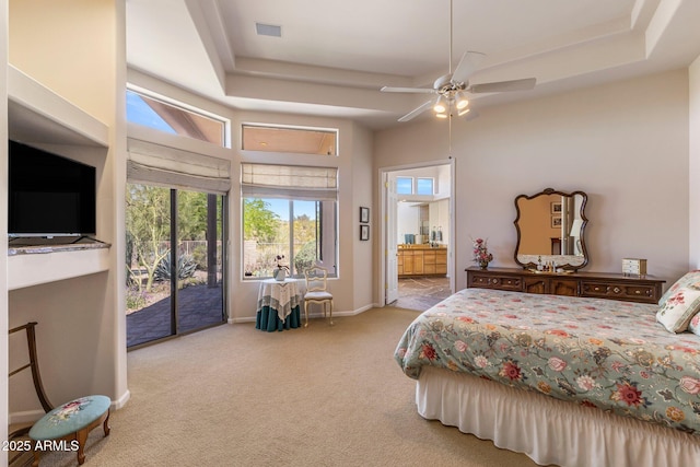 23760 N 80th Way, Scottsdale, AZ 85255 - bedroom with a tray ceiling, carpet flooring, access to exterior, ensuite bathroom, and a ceiling fan