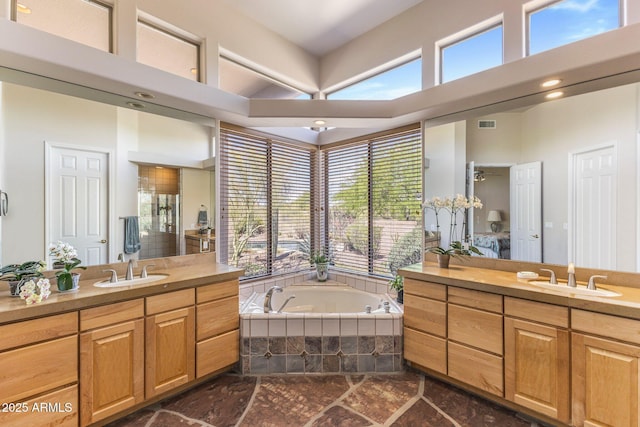 23760 N 80th Way, Scottsdale, AZ 85255 - bathroom featuring two vanities, a bath, and a high ceiling