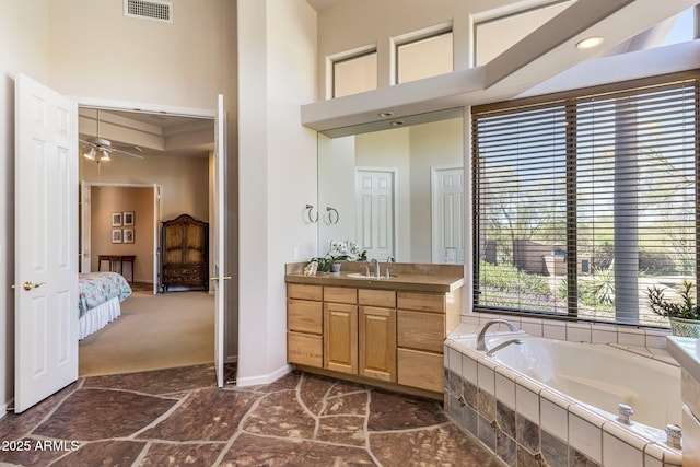 23760 N 80th Way, Scottsdale, AZ 85255 - bathroom featuring a towering ceiling, a bath, a ceiling fan, vanity, and ensuite bathroom