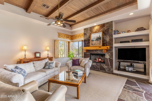 23760 N 80th Way, Scottsdale, AZ 85255 - living area featuring wood ceiling, a fireplace, beam ceiling, stone finish flooring, and a ceiling fan