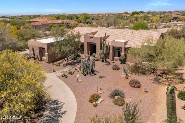 23760 N 80th Way, Scottsdale, AZ 85255 - pueblo revival-style home with stucco siding and a chimney