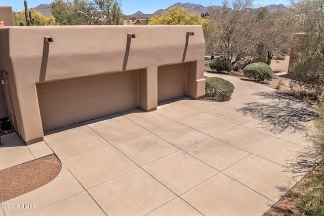 23760 N 80th Way, Scottsdale, AZ 85255 - garage with concrete driveway and a mountain view