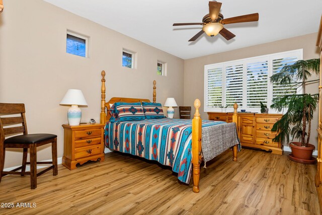 bedroom featuring a ceiling fan and wood finished floors