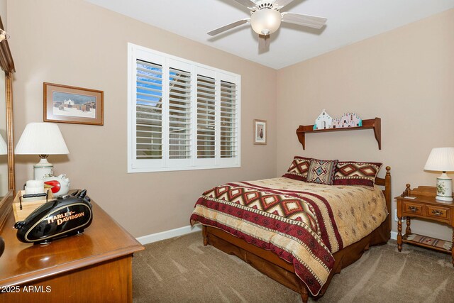 carpeted bedroom with baseboards and ceiling fan