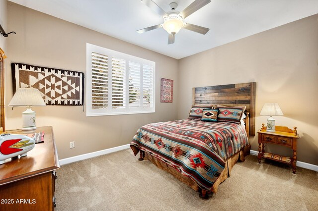 bedroom with baseboards, ceiling fan, and carpet flooring