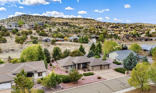 bird's eye view featuring a residential view and a mountain view