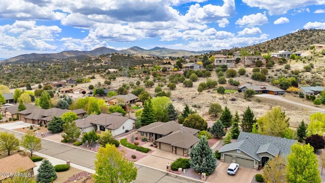 drone / aerial view with a residential view and a mountain view