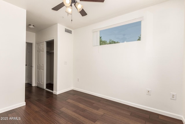 3633 N 3rd Ave Unit 2031, Phoenix, AZ 85013 - unfurnished bedroom with dark wood-style flooring, a closet, and a ceiling fan