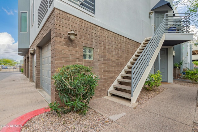 3633 N 3rd Ave Unit 2031, Phoenix, AZ 85013 - entrance to property featuring brick siding, stucco siding, driveway, and an attached garage