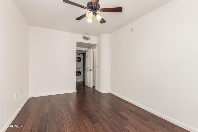 3633 N 3rd Ave Unit 2031, Phoenix, AZ 85013 - empty room with stacked washing machine and dryer, a ceiling fan, dark wood-style flooring, and a smoke detector