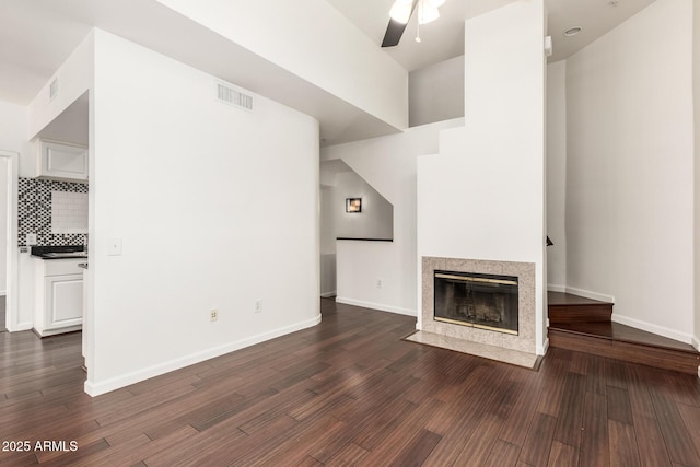 3633 N 3rd Ave Unit 2031, Phoenix, AZ 85013 - unfurnished living room with a ceiling fan, dark wood-style flooring, and a fireplace