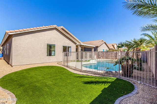 view of swimming pool with a lawn, a patio area, a fenced backyard, and a fenced in pool