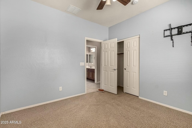 unfurnished bedroom with light carpet, a ceiling fan, visible vents, and baseboards