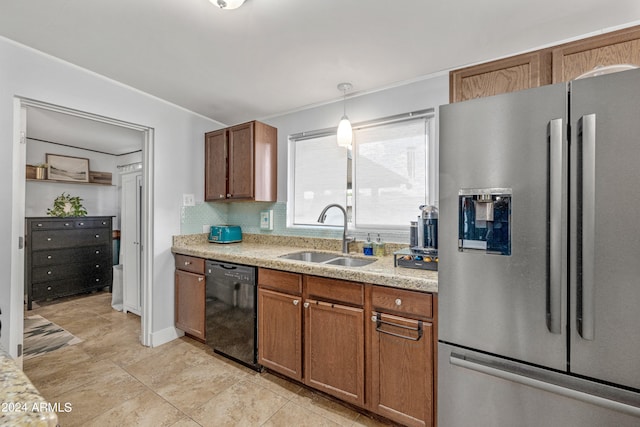 kitchen with pendant lighting, black dishwasher, tasteful backsplash, stainless steel fridge with ice dispenser, and sink