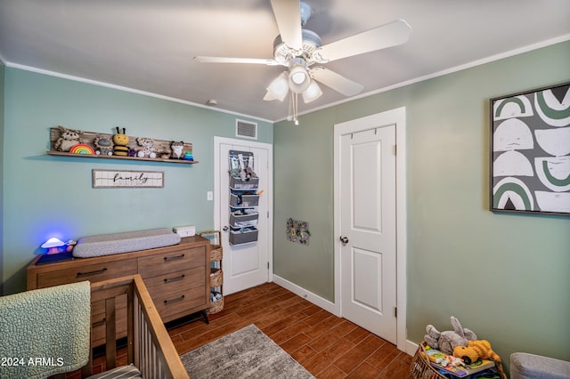 bedroom featuring crown molding, ceiling fan, and dark wood-type flooring