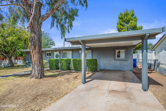 view of front of home featuring a carport