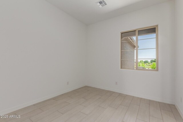 21640 E Roundup Way, Queen Creek, AZ 85142 - spare room featuring baseboards and light wood-style flooring