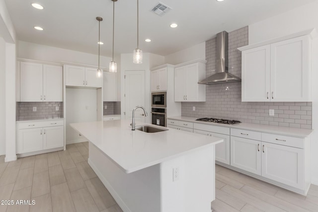 21640 E Roundup Way, Queen Creek, AZ 85142 - kitchen with a sink, wall chimney range hood, gas stovetop, backsplash, and white cabinetry