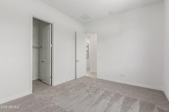 21640 E Roundup Way, Queen Creek, AZ 85142 - unfurnished bedroom with carpet, a spacious closet, and baseboards