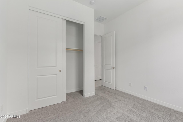 21640 E Roundup Way, Queen Creek, AZ 85142 - unfurnished bedroom with carpet flooring, a closet, and baseboards