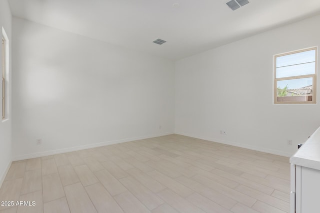 21640 E Roundup Way, Queen Creek, AZ 85142 - spare room featuring baseboards and light wood finished floors