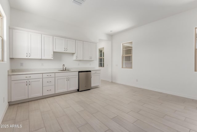 21640 E Roundup Way, Queen Creek, AZ 85142 - kitchen with a sink, refrigerator, light countertops, and white cabinetry