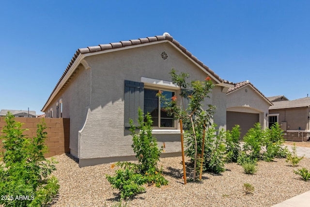 21640 E Roundup Way, Queen Creek, AZ 85142 - view of front of house featuring a garage, stucco siding, and a tile roof