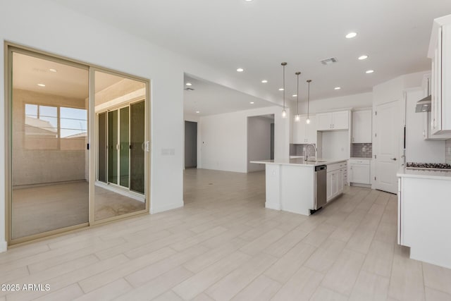 21640 E Roundup Way, Queen Creek, AZ 85142 - kitchen with open floor plan, a sink, light countertops, white cabinetry, and recessed lighting