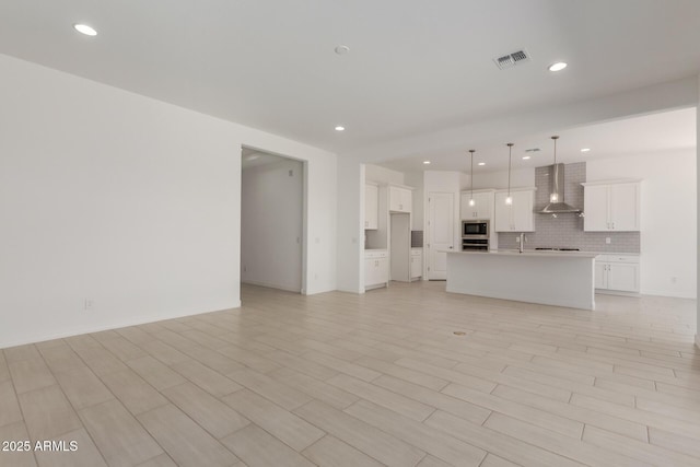 21640 E Roundup Way, Queen Creek, AZ 85142 - unfurnished living room with recessed lighting and a sink