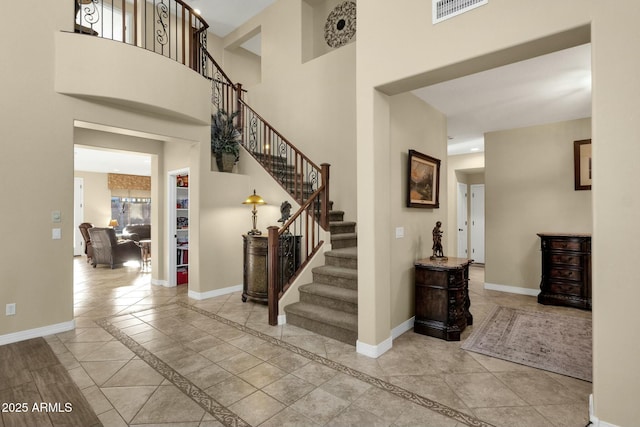 entryway with light tile patterned floors