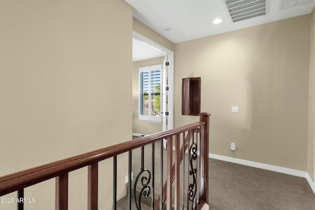 hallway with carpet flooring