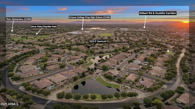 aerial view at dusk with a water view