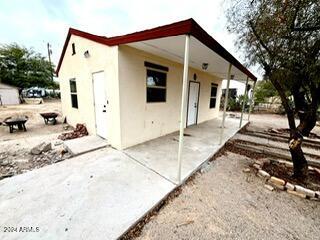 rear view of property featuring a patio area