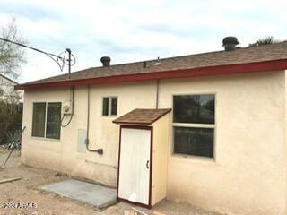 531 W Ocotillo Ave, Ajo, AZ 85321 - back of property with stucco siding and roof with shingles