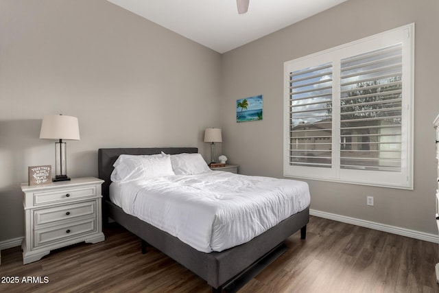 bedroom with dark wood-type flooring, baseboards, and a ceiling fan