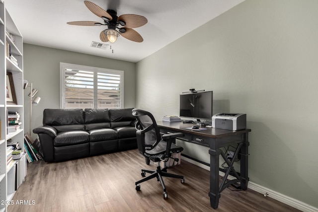 office area featuring ceiling fan, wood finished floors, visible vents, and baseboards