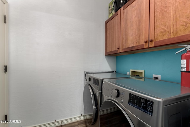 laundry room with cabinet space and separate washer and dryer