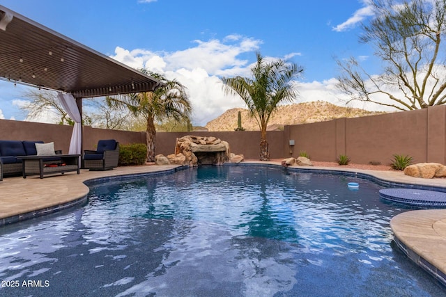 view of pool featuring a patio area, a fenced backyard, and a fenced in pool