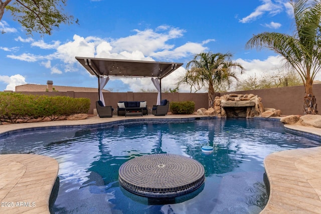 view of swimming pool featuring a fenced backyard, an outdoor living space, a fenced in pool, and a patio