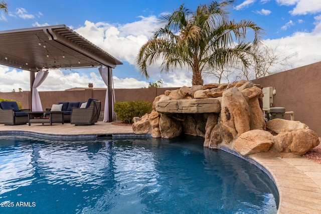 view of pool featuring an outdoor living space, a patio area, fence, and a fenced in pool