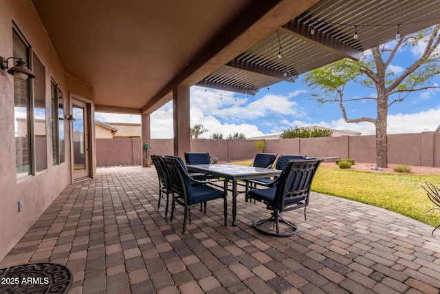 view of patio / terrace featuring outdoor dining area, a fenced backyard, and a pergola