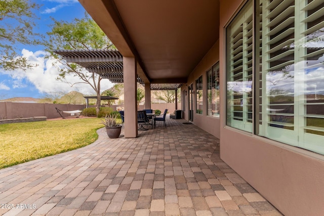 view of patio / terrace with outdoor dining area, fence, and a pergola