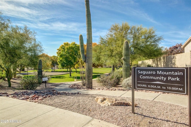 view of home's community with a yard