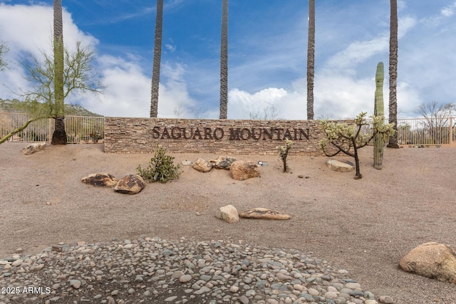 community sign featuring fence