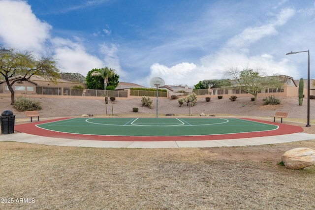 view of basketball court featuring community basketball court and fence