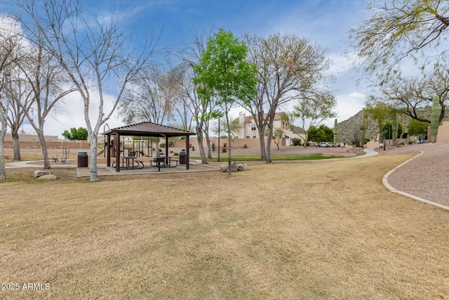 view of property's community featuring a lawn and a gazebo