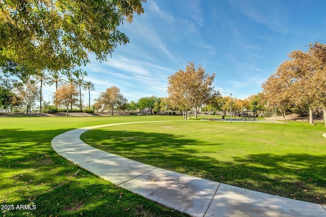 view of property's community featuring a yard