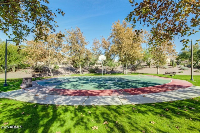 view of home's community featuring community basketball court and a yard