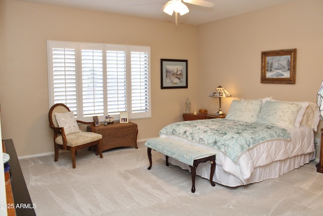 bedroom with ceiling fan and carpet