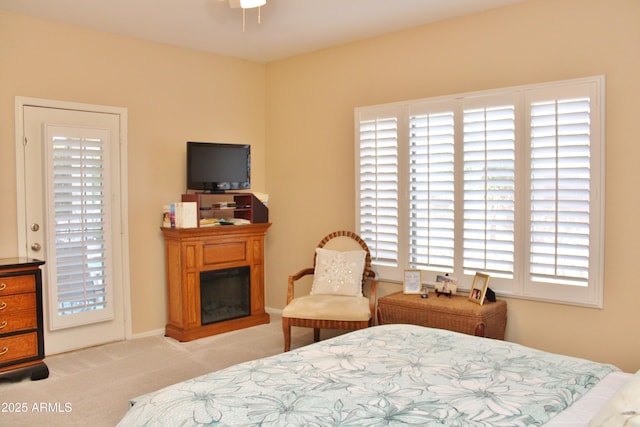 carpeted bedroom featuring access to exterior